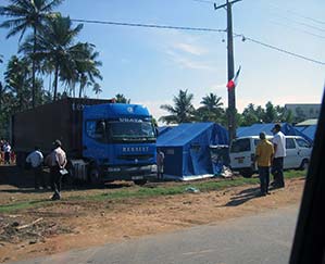 Emergency supplies are in this truck next to a tent in Sri Lanka after the 2004 tsunami.
