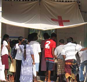 People line up for medical attention following the tsunami that hit Sri Lanka in 2004.